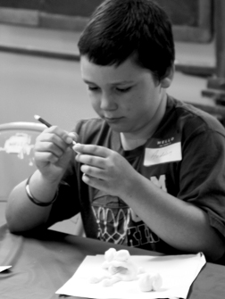 Aeddon Cartwright of Archbold sculpts a frog in Natur-tastic Art Camp.