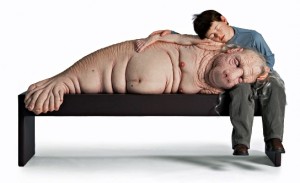 Patricia Piccinini. The Long Awaited (2008), Silicone, fibreglass, human hair, leather, plywood, clothing. 152x80x92cmThe Long Awaited, 2008. Silicone, fiberglass, human hair, leather, plywood, and fabric, 59 7/8 x 31 1/2 x 36 1/4 in. Collection of Penny Clive. Courtesy of the Artist.